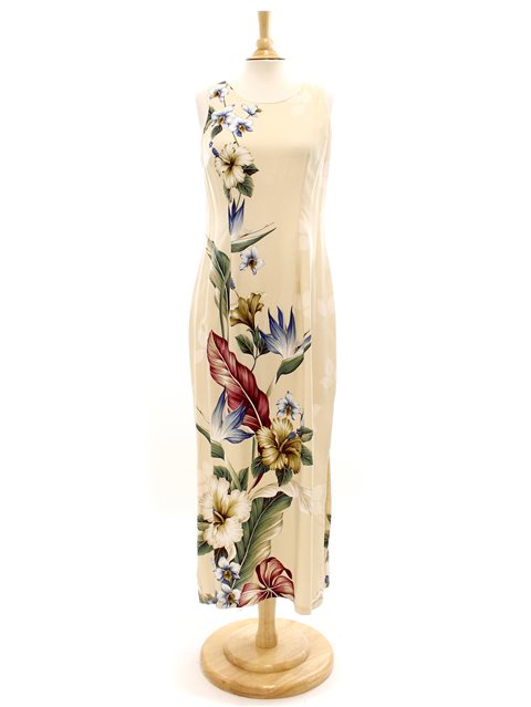 A long dress with a tropical flower print, displayed on a wooden mannequin. The dress is primarily cream-colored with a large floral pattern.